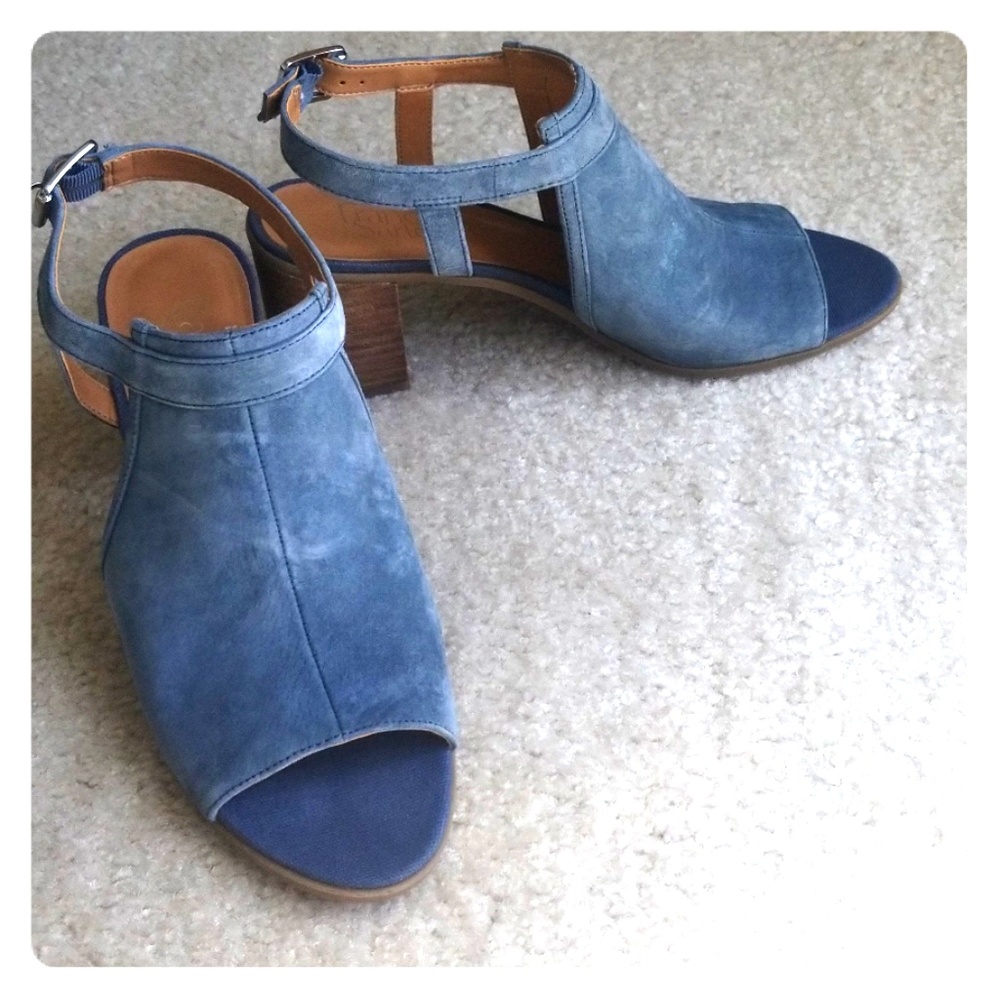 Denim blue suede open toed slingback shoes.